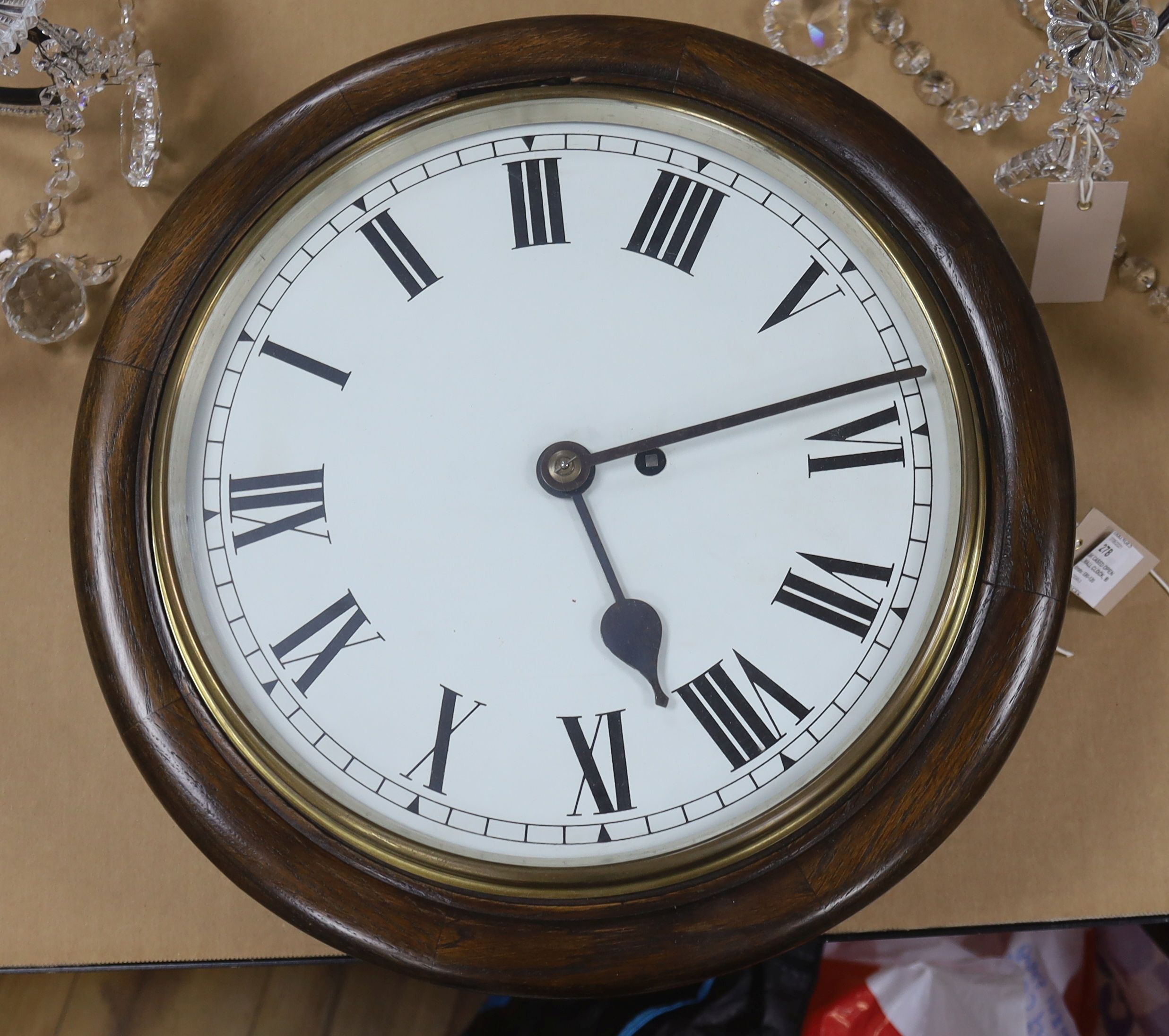 An oak cased single fusee dial wall clock, black Roman numerals on a white 12